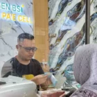 Transaksi keuangan melalui BSI Agen. (Foto: Dok BSI).