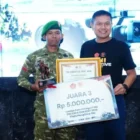 Prajurit Pendam IM, Pratu Riski Febrian, menerima penghargaan lomba fotografi HUT Ke-81 TNI di Jakarta. (Foto:Dok/Kodam IM)